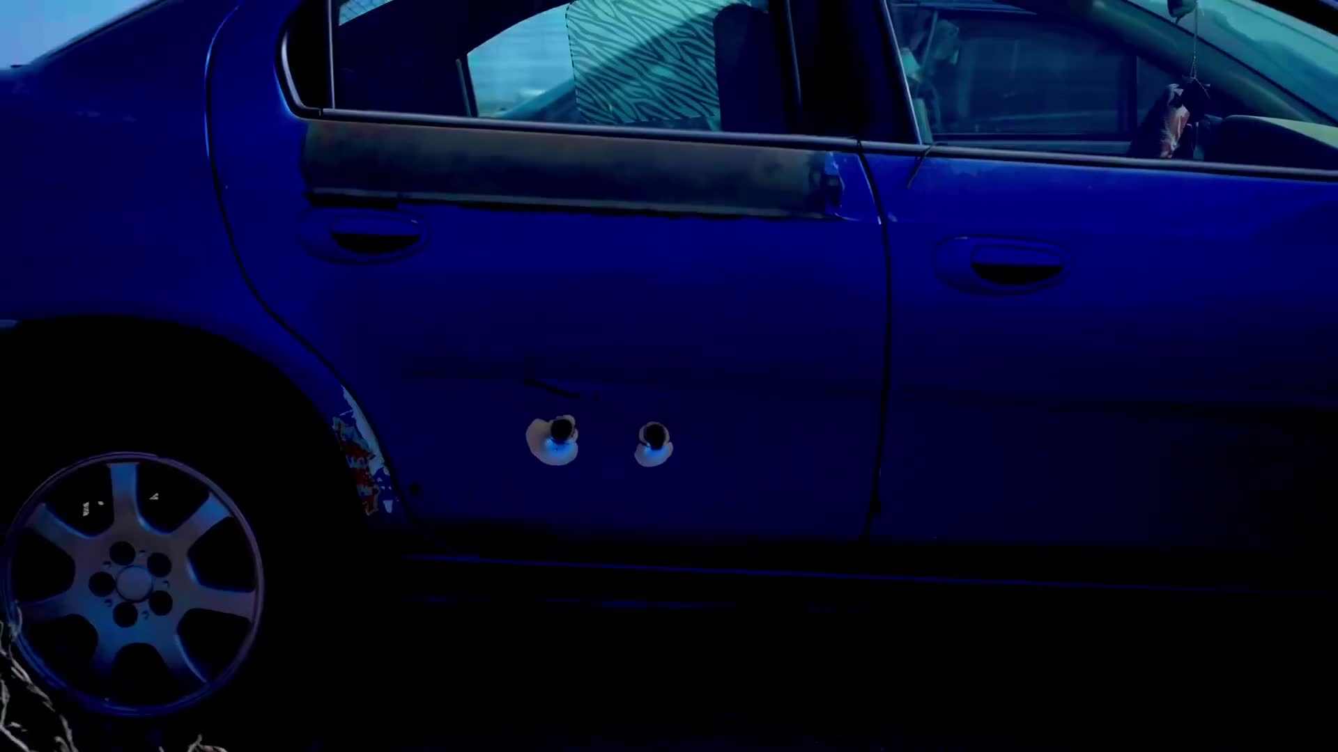 Live-fire test of a shotgun slug shot through stacked car doors
