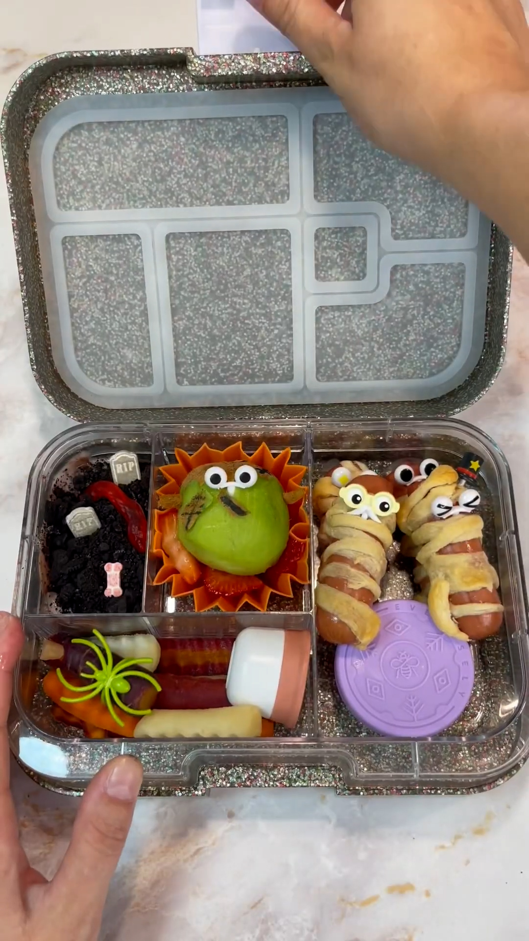 Spooky Halloween themed school lunch with festive shapes and treats