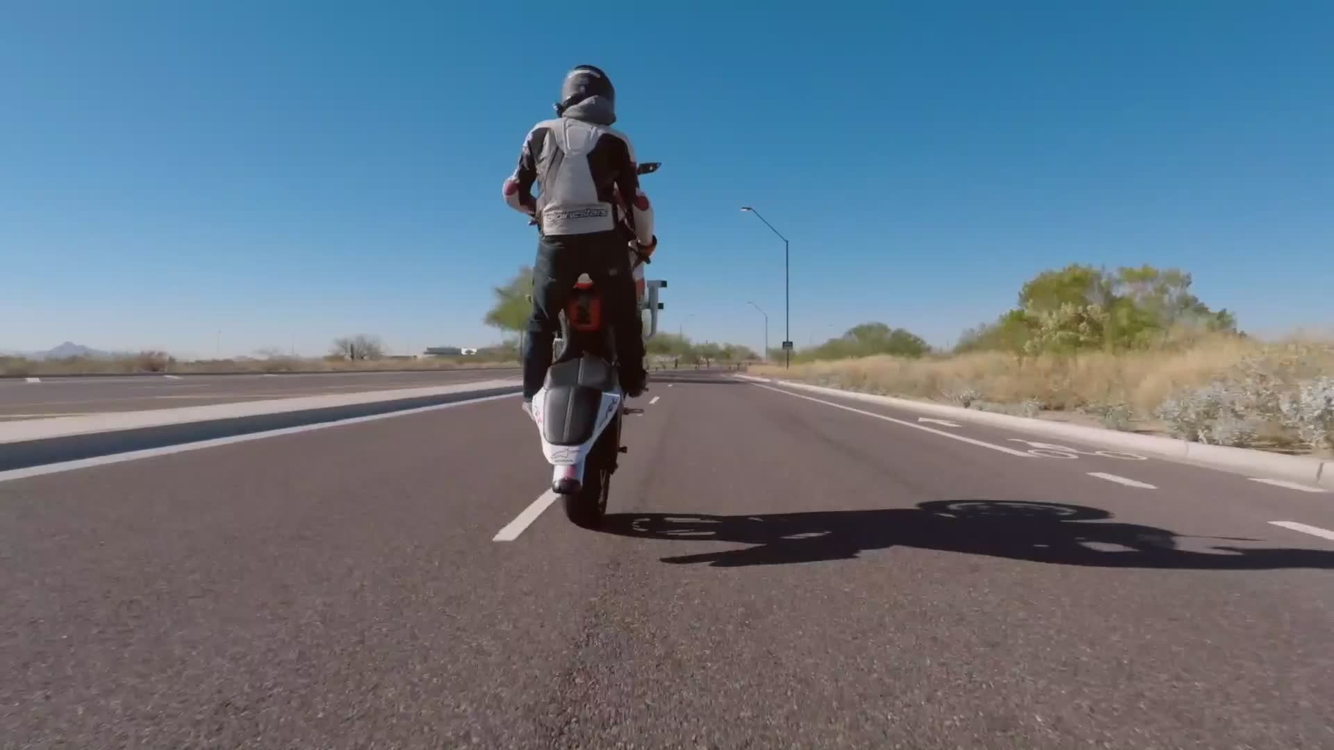 Doing wheelies with my mom